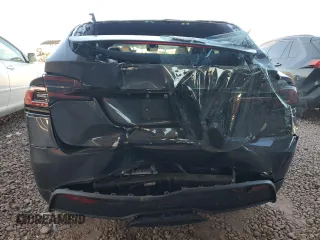 2023 Tesla Model X with VIN 7SAXCAE5XPF384061, listed as a Copart auction lot 86834084 with 6,974 mi miles and Salvage Title. Bid and sale history available at DreamBid. Image 6.