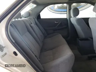2001 Toyota Camry CE z VIN JT2BG22K010543907, wystawiony jako Copart lot #60874815 z przebiegiem 313 008 mil mil oraz Czysty tytuł • Clean title. Historia ofert i sprzedaży dostępna na DreamBid. Obrazek 10.