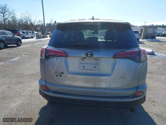 2018 Toyota RAV4 LE with VIN 2T3BFREV7JW728587, listed as a IAAI auction lot 41312419 with 103,134 mi miles. Bid and sale history available at carsss.com. Image 16.