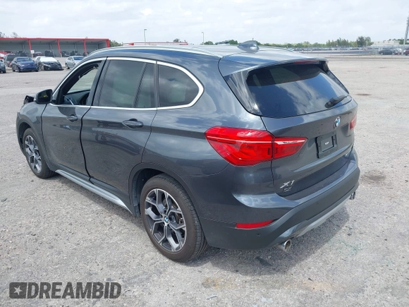 2022 BMW X1 sDrive28i with VIN WBXJG7C00N5U59675, listed as a IAAI auction lot 41915231 with 34,983 mi miles. Bid and sale history available at carsss.com. Image 3.