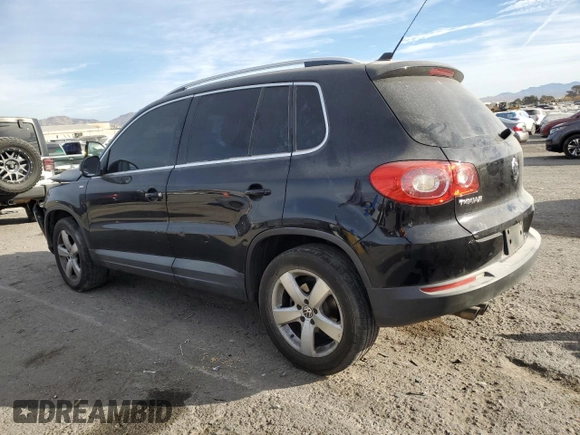 2010 Volkswagen Tiguan Wolfsburg Edition with VIN WVGAV7AX5AW002900, listed as a Copart auction lot 86214514 with 153,645 mi miles and Salvage title. Bid and sale history available at DreamBid. Image 2.