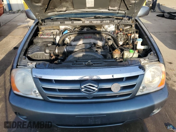 2004 Suzuki XL7 LX z VIN JS3TX92V544113643, wystawiony jako Copart lot #77832874 z przebiegiem Nie podano mil oraz Szkoda całkowita • Salvage title. Historia ofert i sprzedaży dostępna na DreamBid. Obrazek 12.