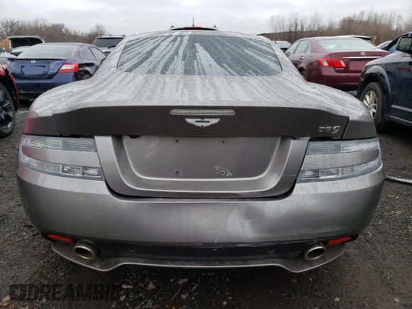 2015 Aston Martin DB9 z VIN SCFFDAEM9FGA16279, wystawiony jako Copart lot #81886554 z przebiegiem 25 029 mil mil oraz Szkoda całkowita • Salvage title. Historia ofert i sprzedaży dostępna na DreamBid. Obrazek 6.