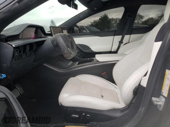 2023 Tesla Model S Plaid with VIN 5YJSA1E67PF511354, listed as a Copart auction lot 56648975 with 69,002 mi miles and Salvage title. Bid and sale history available at DreamBid. Image 7.