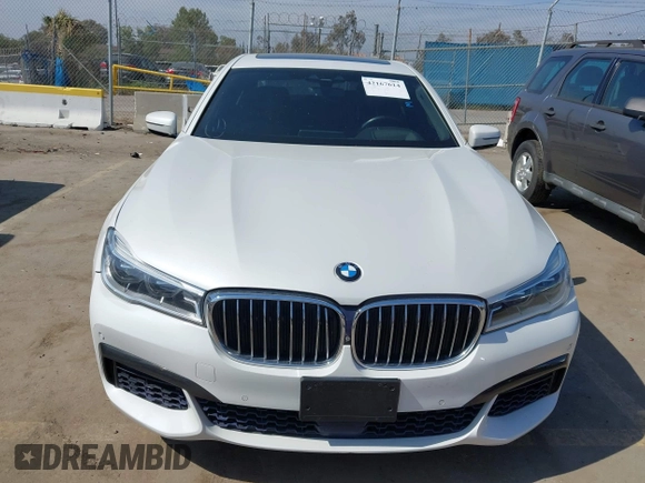 2019 BMW 7 Series 750i with VIN WBA7F0C5XKGM25771, listed as a IAAI auction lot 42167614 with 73,692 mi miles. Bid and sale history available at carsss.com. Image 12.