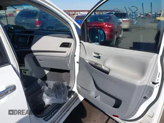 2014 Toyota Sienna SE with VIN 5TDXK3DCXES427950, listed as a IAAI auction lot 40394109 with 149,419 mi miles. Bid and sale history available at carsss.com. Image 5.