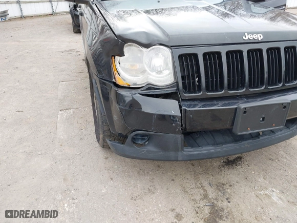 2009 Jeep Grand Cherokee Laredo with VIN 1J8GR48K19C546439, listed as a IAAI auction lot 42097256 with 146,930 mi miles. Bid and sale history available at carsss.com. Image 6.
