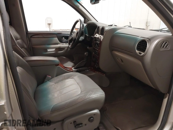 2004 GMC Envoy SLE with VIN 1GKDT13S042243883, listed as a IAAI auction lot 41795335 with 162,873 mi miles. Bid and sale history available at carsss.com. Image 5.