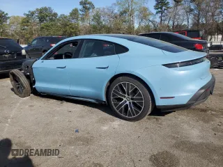 2023 Porsche Taycan with VIN WP0AA2Y11PSA11164, listed as a Copart auction lot 50695385 with 23,833 mi miles and Salvage Title. Bid and sale history available at DreamBid. Image 2.