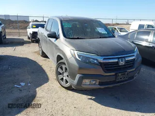 2020 Honda Ridgeline RTL-E with VIN 5FPYK3F72LB011694, listed as a IAAI auction lot 41628184 with 76,011 mi miles and . Bid and sale history available at DreamBid. Image 1.