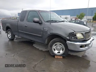 2003 Ford F-150 XL with VIN 1FTRX17W03NB51687, listed as a IAAI auction lot 41712022 with 183,428 mi miles. Bid and sale history available at carsss.com. Image 1.