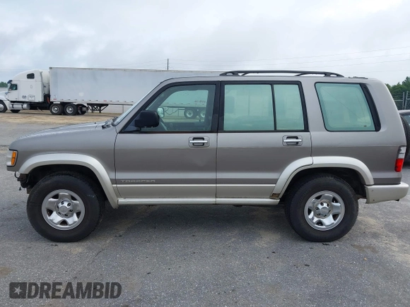 2002 Isuzu Trooper S with VIN JACDJ58X527J07745, listed as a IAAI auction lot 42714673 with 122,482 mi miles and . Bid and sale history available at DreamBid. Image 14.