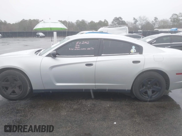 2014 Dodge Charger Police with VIN 2C3CDXAG1EH282873, listed as a IAAI auction lot 41272037 with 133,502 mi miles and . Bid and sale history available at DreamBid. Image 14.