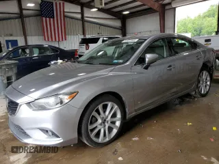 2014 Mazda 6 i Grand Touring с VIN JM1GJ1W64E1127168, выставлен на аукционе Copart как лот 57997465 с пробегом 132 968 миль миль и Списание • Salvage title. История ставок и продаж доступна на DreamBid. Изображение 1.