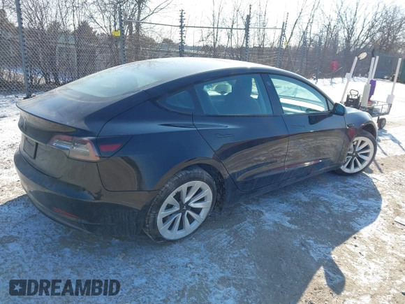 2022 Tesla Model 3 with VIN 5YJ3E1EA1NF304811, listed as a IAAI auction lot 41559342 with 29,597 mi miles and . Bid and sale history available at DreamBid. Image 4.