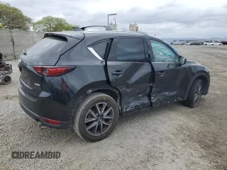 2018 Mazda CX-5 Grand Touring with VIN JM3KFADM3J1370114, listed as a Copart auction lot 54579585 with 65,513 mi miles and Salvage Title. Bid and sale history available at DreamBid. Image 3.