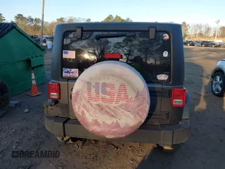 2018 Jeep Wrangler JK Unlimited Sport with VIN 1C4BJWDG2JL810424, listed as a IAAI auction lot 41610669 with 73,830 mi miles. Bid and sale history available at carsss.com. Image 16.