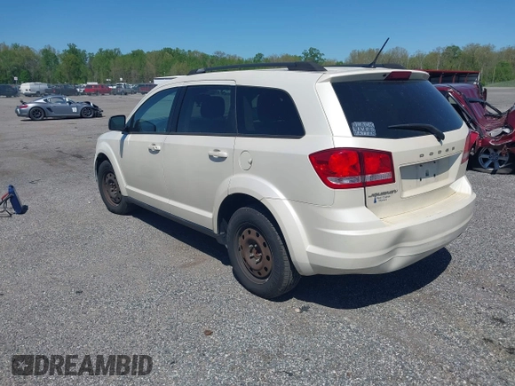 2014 Dodge Journey SE with VIN 3C4PDCAB9ET121415, listed as a IAAI auction lot 42138601 with 157,043 mi miles. Bid and sale history available at carsss.com. Image 3.