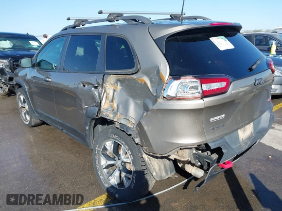 2017 Jeep Cherokee Trailhawk L Plus with VIN 1C4PJMBB6HW654172, listed as a IAAI auction lot 41851236 with 104,263 mi miles. Bid and sale history available at carsss.com. Image 3.