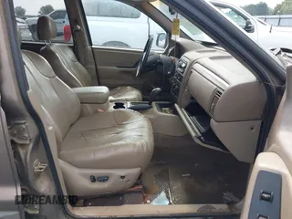 2001 Jeep Grand Cherokee Laredo z VIN 1J4GX48N51C548958, wystawiony jako IAAI lot #42460303 z przebiegiem 210 379 mil mil oraz . Historia ofert i sprzedaży dostępna na DreamBid. Obrazek 5.