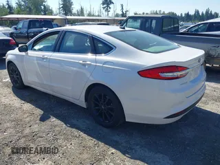 2017 Ford Fusion SE z VIN 3FA6P0HD3HR132779, wystawiony jako IAAI lot #42690212 z przebiegiem 165 293 mil mil oraz . Historia ofert i sprzedaży dostępna na DreamBid. Obrazek 3.