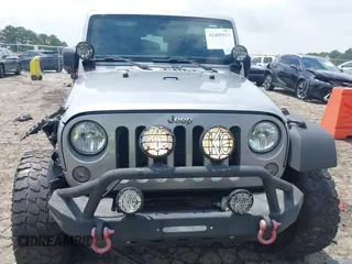 2016 Jeep Wrangler Black Bear with VIN 1C4AJWAG5GL258426, listed as a IAAI auction lot 42400914 with 128,606 mi miles and . Bid and sale history available at DreamBid. Image 12.