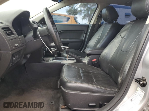 2012 Ford Fusion SEL with VIN 3FAHP0JG7CR257418, listed as a Copart auction lot 61842175 with 167,669 mi miles and Salvage title. Bid and sale history available at DreamBid. Image 7.