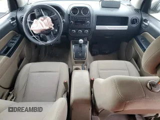 2014 Jeep Compass Sport with VIN 1C4NJCBA5ED844934, listed as a Copart auction lot 52774945 with 148,897 mi miles and Salvage Title. Bid and sale history available at carsss.com. Image 8.