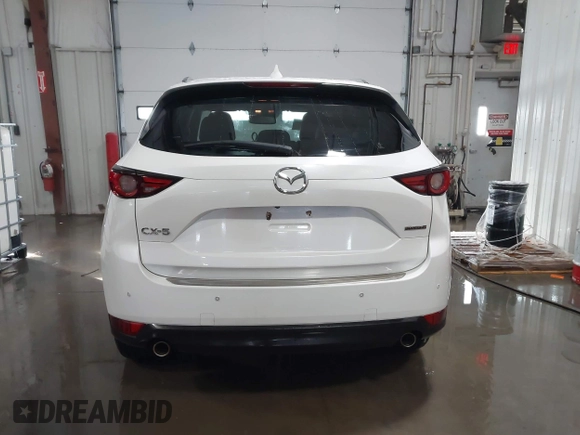 2021 Mazda CX-5 Grand Touring with VIN JM3KFADM3M0312143, listed as a IAAI auction lot 41606582 with 46,515 mi miles. Bid and sale history available at carsss.com. Image 16.