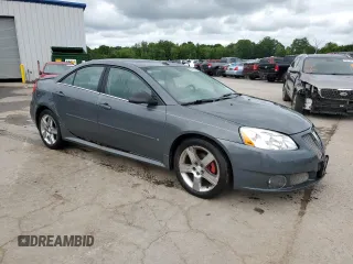 2009 Pontiac G6 GXP 1SA with VIN 1G2ZM577294217264, listed as a Copart auction lot 63824735 with 165,948 mi miles and Salvage title. Bid and sale history available at DreamBid. Image 4.