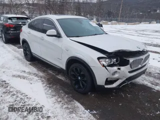 2018 BMW X4 xDrive28i with VIN 5UXXW3C5XJ0T82043, listed as a IAAI auction lot 41246495 with 106,606 mi miles. Bid and sale history available at carsss.com. Image 1.
