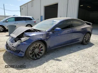 2023 Tesla Model 3 Performance z VIN 5YJ3E1EC4PF558646, wystawiony jako Copart lot #55201985 z przebiegiem 24 455 mil mil oraz Nie do naprawy. Historia ofert i sprzedaży dostępna na DreamBid. Obrazek 1.