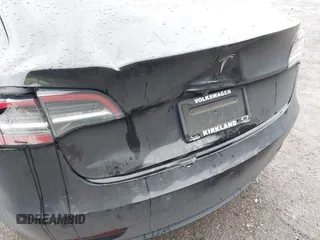 2019 Tesla Model 3 Mid Range with VIN 5YJ3E1EAXKF296378, listed as a IAAI auction lot 41739616 with 77,100 mi miles and . Bid and sale history available at DreamBid. Image 6.