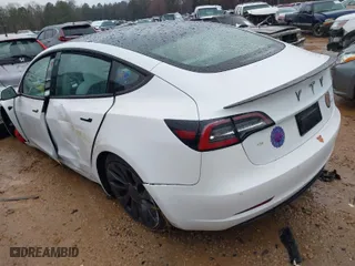 2021 Tesla Model 3 Performance with VIN 5YJ3E1EC3MF995632, listed as a IAAI auction lot 41548478 with 43,585 mi miles. Bid and sale history available at carsss.com. Image 3.