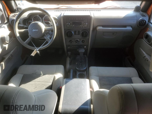 2010 Jeep Wrangler Rubicon with VIN 1J4BA6D17AL208835, listed as a Copart auction lot 41851855 with 107,771 mi miles and Salvage title. Bid and sale history available at DreamBid. Image 8.