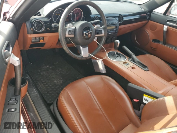 2007 Mazda MX-5 Miata Sport z VIN JM1NC25F270127574, wystawiony jako Copart lot #51538215 z przebiegiem 131 339 mil mil oraz Szkoda całkowita • Salvage title. Historia ofert i sprzedaży dostępna na DreamBid. Obrazek 8.