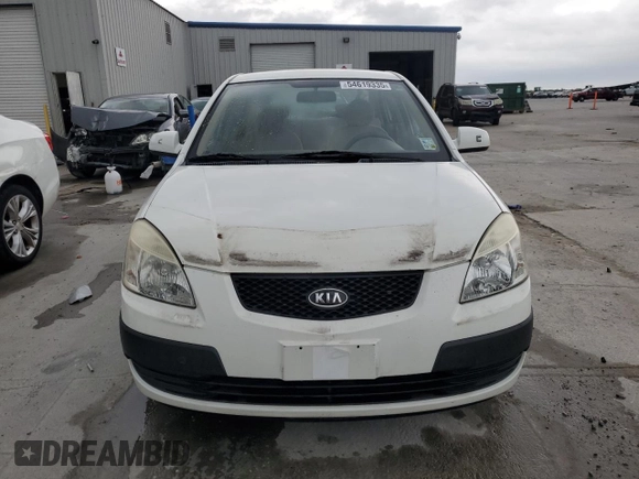 2009 Kia Rio LX with VIN KNADE223X96439445, listed as a Copart auction lot 54619335 with 102,120 mi miles and Salvage Title. Bid and sale history available at DreamBid. Image 5.