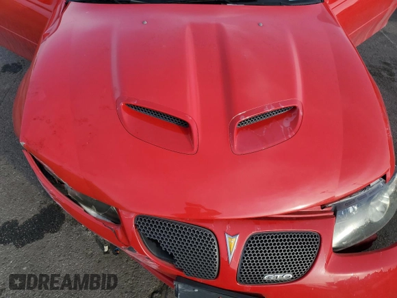 2006 Pontiac GTO z VIN 6G2VX12U06L561062, wystawiony jako Copart lot #44526895 z przebiegiem 73 242 mil mil oraz Szkody całkowita. Historia ofert i sprzedaży dostępna na DreamBid. Obrazek 11.