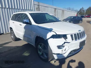 2016 Jeep Grand Cherokee Overland with VIN 1C4RJFCT0GC333868, listed as a IAAI auction lot 41650392 with 161,636 mi miles and . Bid and sale history available at DreamBid. Image 1.