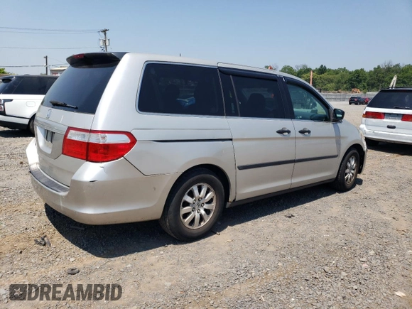 2007 Honda Odyssey LX with VIN 5FNRL38287B054504, listed as a Copart auction lot 59141665 with 128,617 mi miles and Salvage title. Bid and sale history available at DreamBid. Image 3.