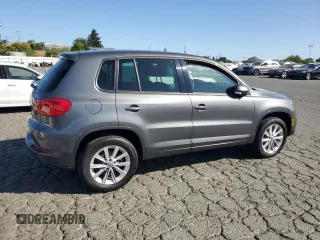 2014 Volkswagen Tiguan SEL with VIN WVGAV3AX8EW585929, listed as a Copart auction lot 61462205 with 63,899 mi miles and Salvage title. Bid and sale history available at DreamBid. Image 3.