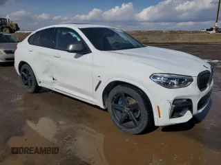 2019 BMW X4 M40i with VIN 5UXUJ5C58KLA93517, listed as a Copart auction lot 51622125 with 127,828 mi miles and Salvage title. Bid and sale history available at DreamBid. Image 4.