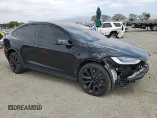 2022 Tesla Model X with VIN 7SAXCDE59NF360610, listed as a Copart auction lot 52575365 with 51,557 mi miles and Salvage Title. Bid and sale history available at carsss.com. Image 4.