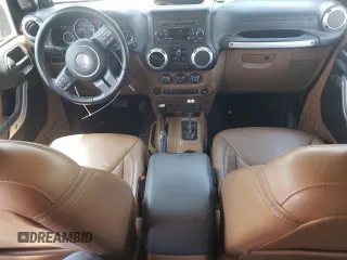 2014 Jeep Wrangler Unlimited Rubicon with VIN 1C4BJWFGXEL291187, listed as a Copart auction lot 54897675 with 227,478 mi miles and Salvage title. Bid and sale history available at DreamBid. Image 8.