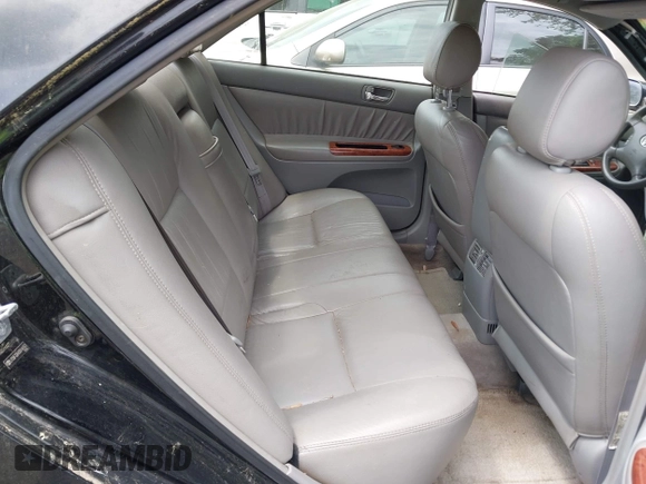 2003 Toyota Camry LE with VIN JTDBF32K430146557, listed as a IAAI auction lot 42102454 with 179,653 mi miles. Bid and sale history available at carsss.com. Image 8.