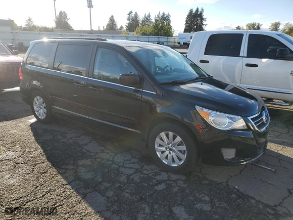 2012 Volkswagen Routan SEL w/Navigation with VIN 2C4RVACG7CR277083, listed as a Copart auction lot 77390214 with 182,990 mi miles and Clean Title. Bid and sale history available at carsss.com. Image 4.