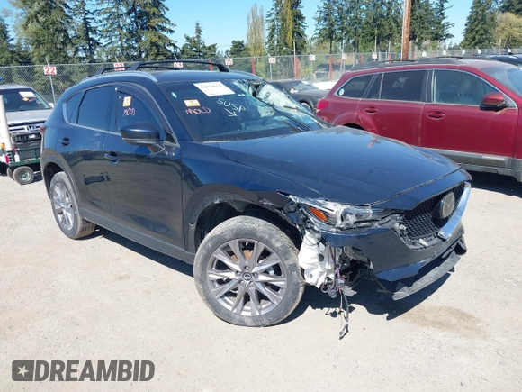 2020 Mazda CX-5 Grand Touring with VIN JM3KFBDM7L0724005, listed as a IAAI auction lot 42034658 with 90,631 mi miles. Bid and sale history available at carsss.com. Image 1.