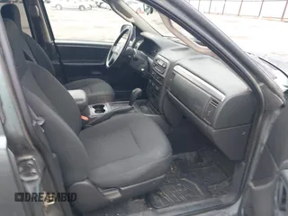 2003 Jeep Grand Cherokee Laredo with VIN 1J4GX48S03C536709, listed as a IAAI auction lot 41908946 with 240,435 mi miles. Bid and sale history available at carsss.com. Image 5.
