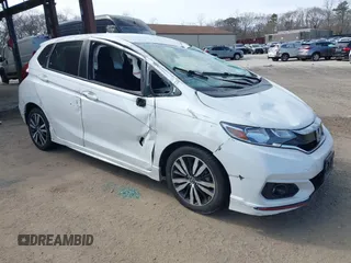2019 Honda Fit Sport z VIN 3HGGK5H67KM719889, wystawiony jako IAAI lot #42054788 z przebiegiem Nie podano mil oraz . Historia ofert i sprzedaży dostępna na DreamBid. Obrazek 1.