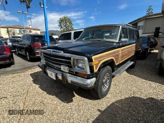 1987 Jeep Grand Wagoneer z VIN 1JCNJ15U7HT153505, wystawiony jako Copart lot #46373925 z przebiegiem 57 931 mil mil oraz Czysty tytuł • Clean title. Historia ofert i sprzedaży dostępna na DreamBid. Obrazek 2.
